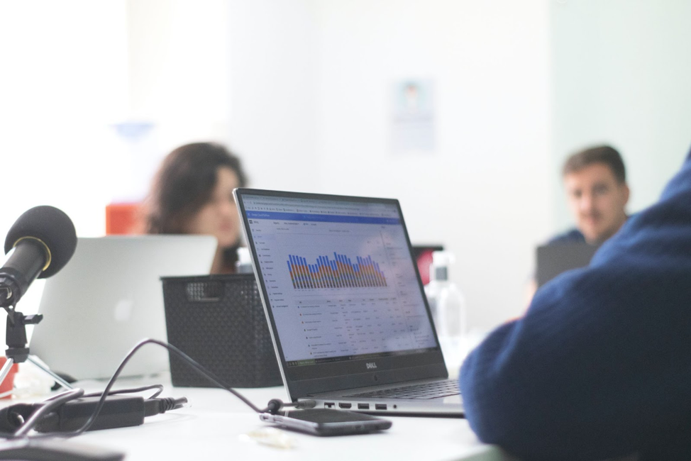 Employee watching Marketing on the flywheel podcast on their computer