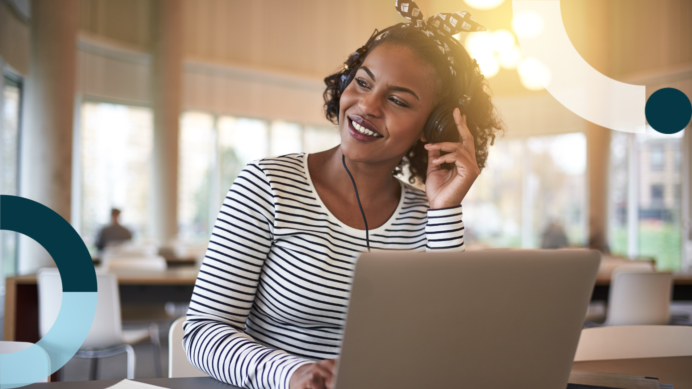 Young office worker listening to Taylor Swift and reading marketing trend predictions