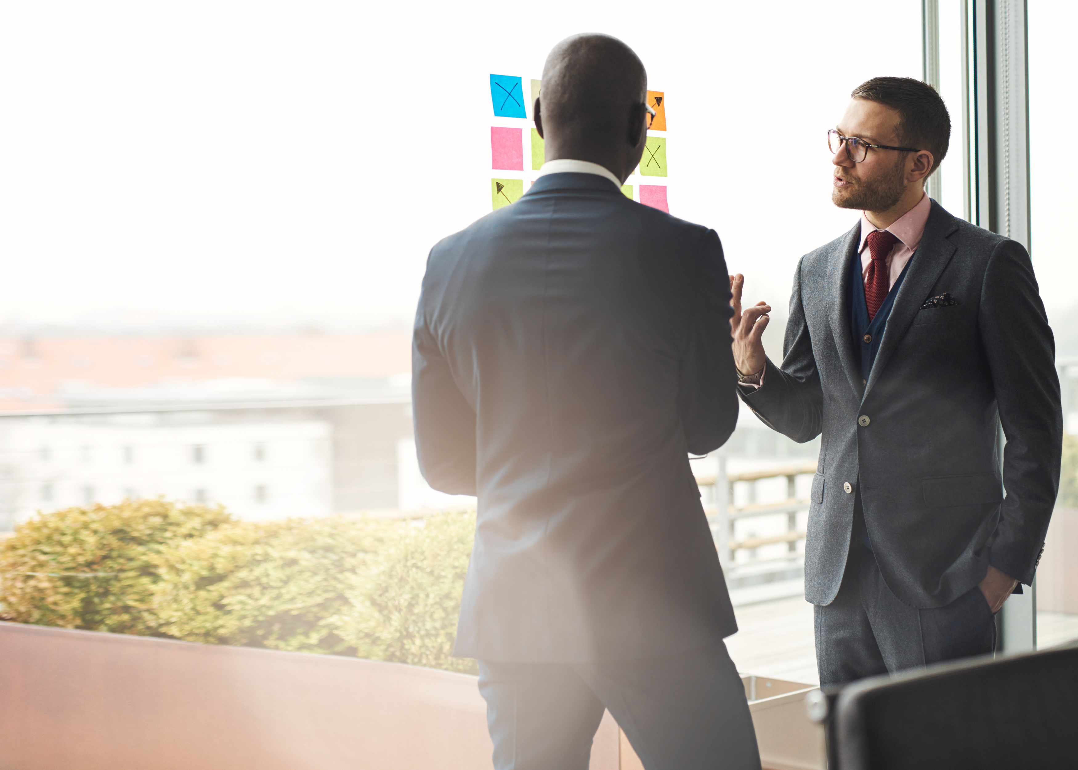 Two business executives standing in an office