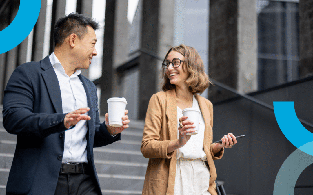 Professionals walking and talking with coffee